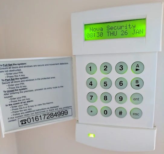 Intruder burglar alarm keypad installed in a Greater Manchester home